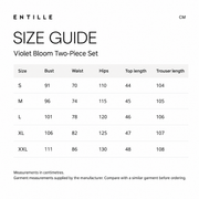 Entille size guide for Violet Bloom Two-Piece Set. Measurements in centimeters. Columns: Size, Bust, Waist, Hips, Top length, Pant length. S, 91, 70, 110, 44, 104; M, 96, 74, 115, 45, 105; L, 101, 78, 120, 46, 106; XL, 106, 82, 125, 47, 107; XXL, 111, 86, 130, 48, 108. Garment measurements supplied by the manufacturer. Compare with a similar garment before ordering.
